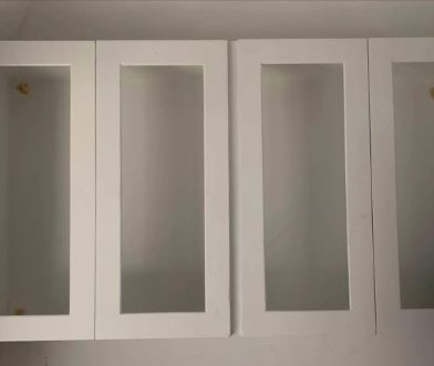 Glazed upper cabinets fitted and aligned